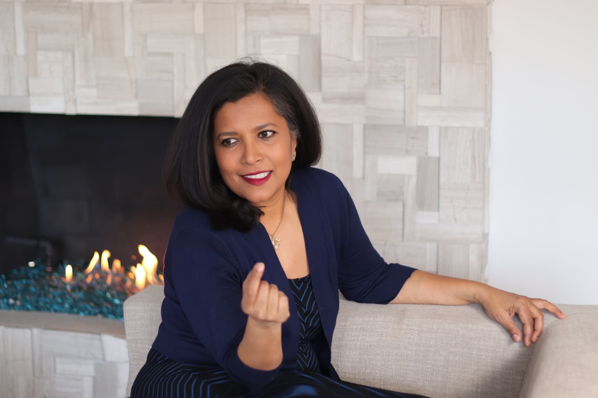 Dr. Gomes by the fireplace